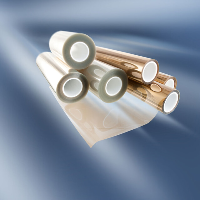 A set of rolled polymer membranes displayed on a smooth blue gradient background.